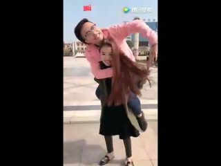 cute girl want to lift her pink boyfriend